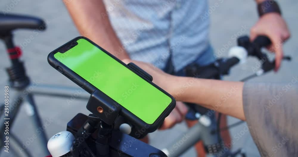 Close-up girl using mock-up smartphone navigation app on e-scooter riding eco transport with boyfriend in modern city at daytime. Close-up girl using mock-up smartphone navigation app on e-scooter riding eco transport with boyfriend in modern city at daytime.