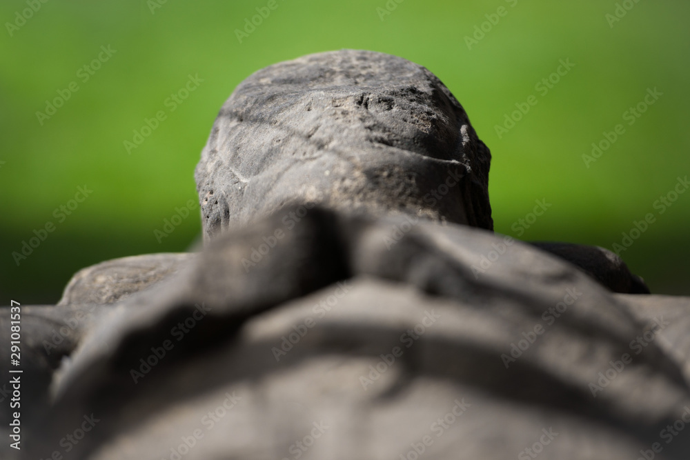 Close up of an ancient marble scottish sarcophagus against a green bokeh background Close up of an ancient marble scottish sarcophagus against a green bokeh background