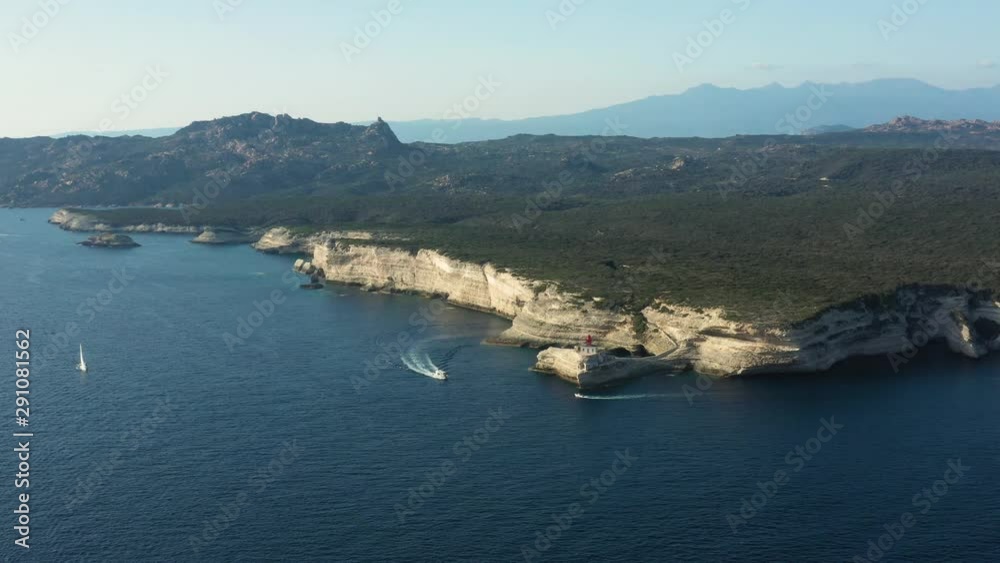 View from above, stunning panoramic view of the lighthouse of Madonnetta at the entrance to the port of Bonifacio. Bonifacio is a commune at the southern tip of the island of Corsica, France. View from above, stunning panoramic view of the lighthouse of Madonnetta at the entrance to the port of Bonifacio. Bonifacio is a commune at the southern tip of the island of Corsica, France.