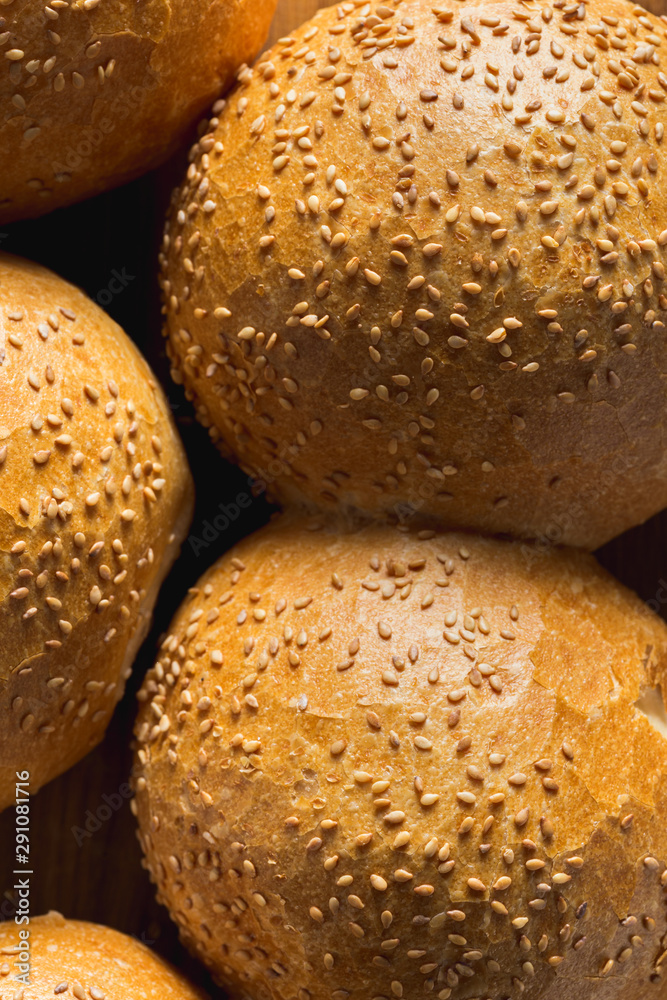 Fresh homemade buns with sesame seeds close up