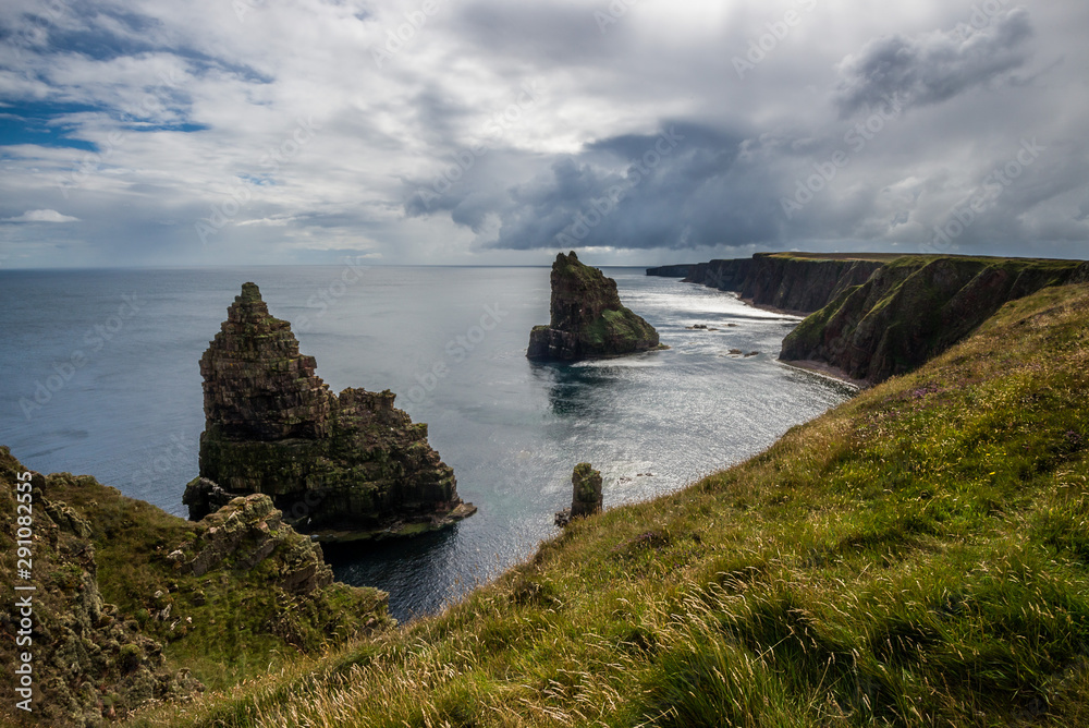 The Duncansby Stacks under a cloudy sky in the late afternoon light