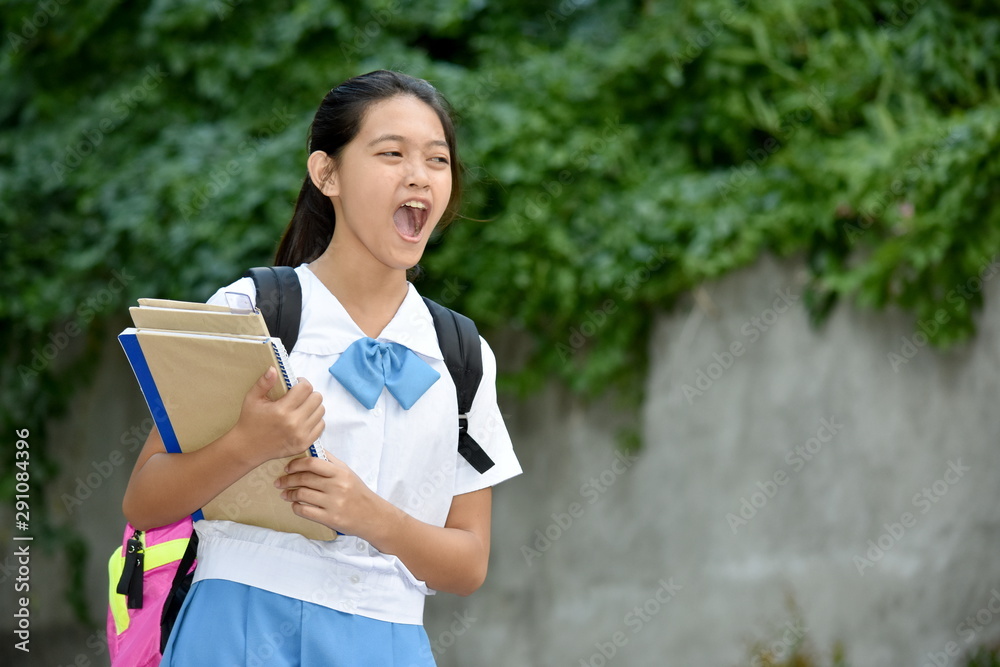 Youthful Filipina Girl Student Yelling With School Books Youthful Filipina Girl Student Yelling With School Books