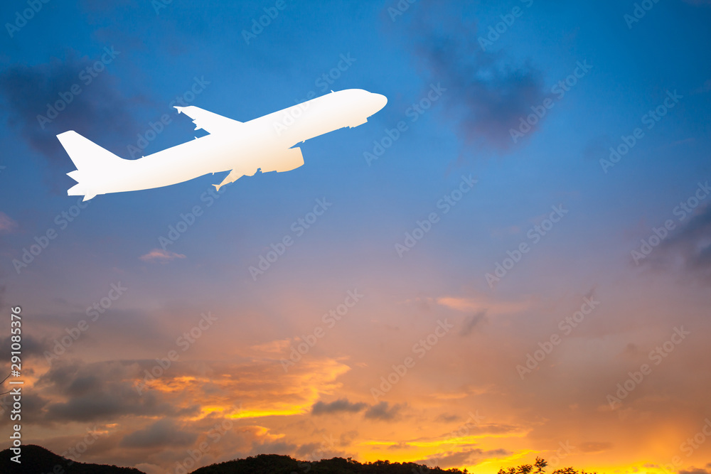 Silhouette airplane flying on Beautiful sunset background.
