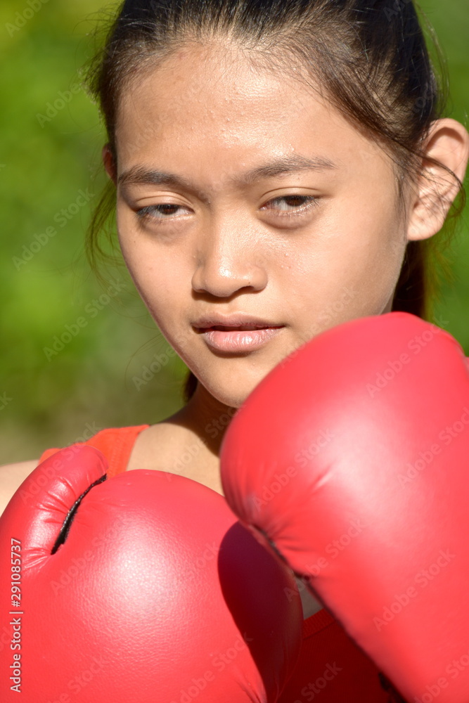 Unemotional Female Athlete Wearing Boxing Gloves Unemotional Female Athlete Wearing Boxing Gloves
