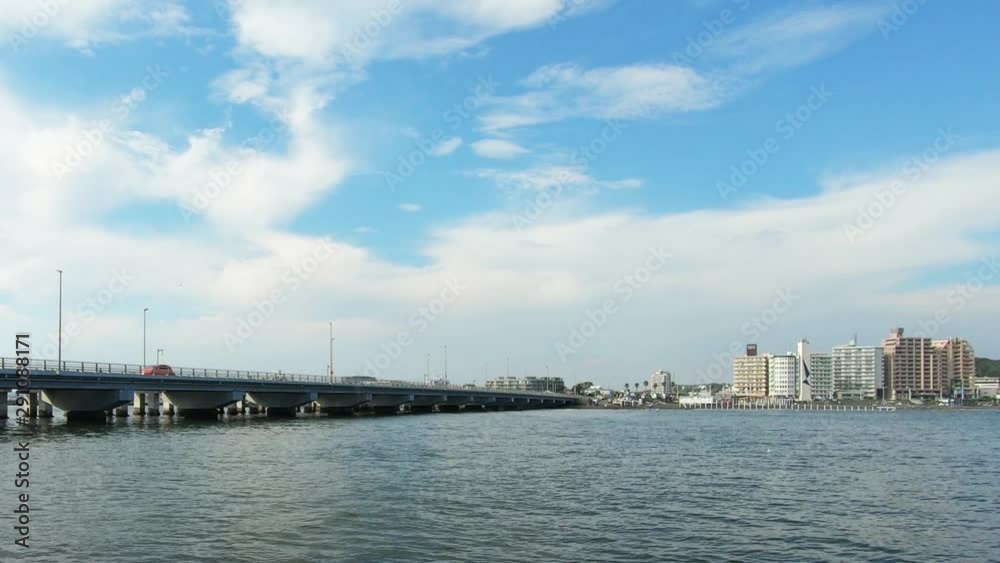 Bridge over the sea and buildings along the sea Bridge over the sea and buildings along the sea