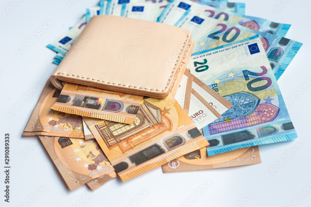 Leather wallet with euro money bill on white background Leather wallet with euro money bill on white background