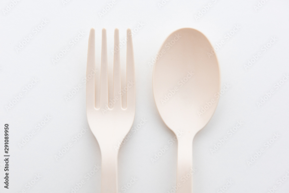 Biodegradable plastic spoon, fork and lunch box on white background isolate Biodegradable plastic spoon, fork and lunch box on white background isolate