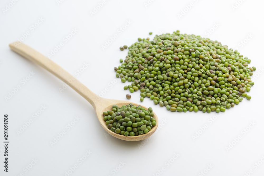 Close-up of mung bean starch flour powder in wooden spoon with white background isolated Close-up of mung bean starch flour powder in wooden spoon with white background isolated