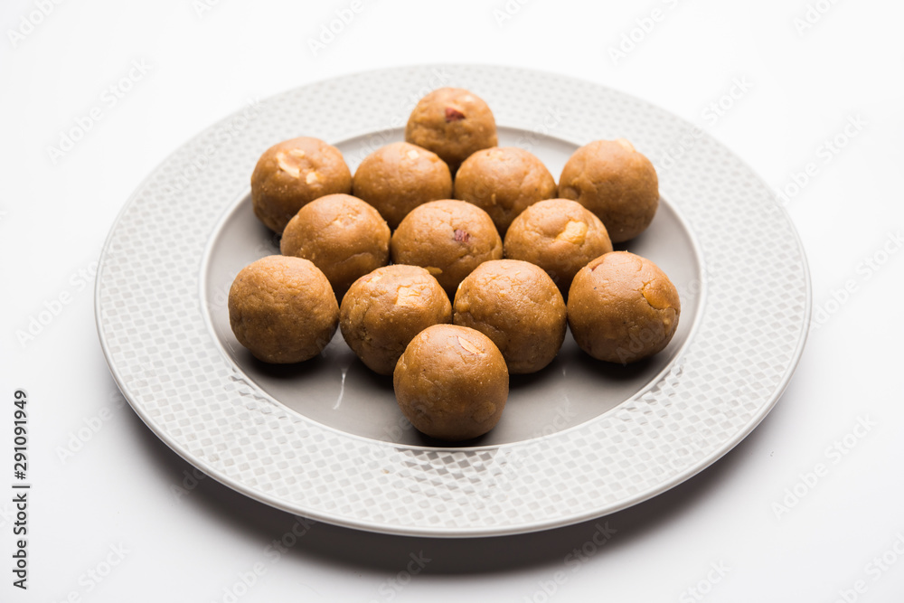 Churma Ladoo / atta laddoo / wheat flour laddu made using ghee and jaggery or sugar. selective focus Churma Ladoo / atta laddoo / wheat flour laddu made using ghee and jaggery or sugar. selective focus