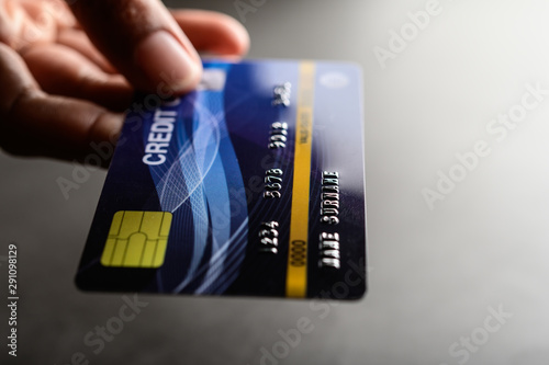 close up of hand holding credit card