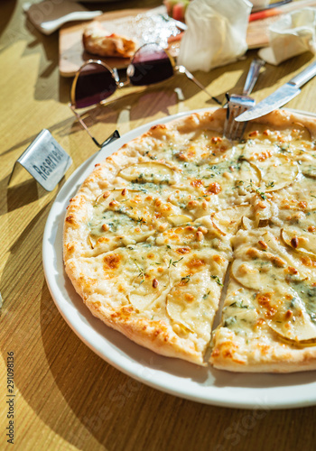 woman eating pizza in the cafe photo