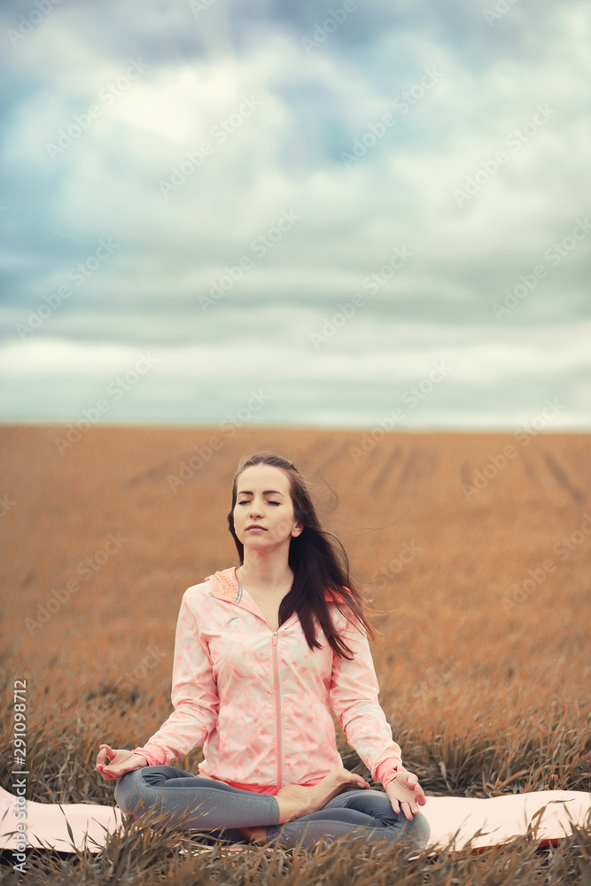 The girl in yoga on the outdoor