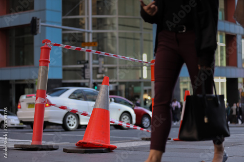 Photography Red and white witches hat cone traffic warning sign barrier applying on busy str