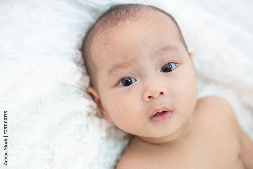 Cute little baby looking into the camera Cute little baby looking into the camera