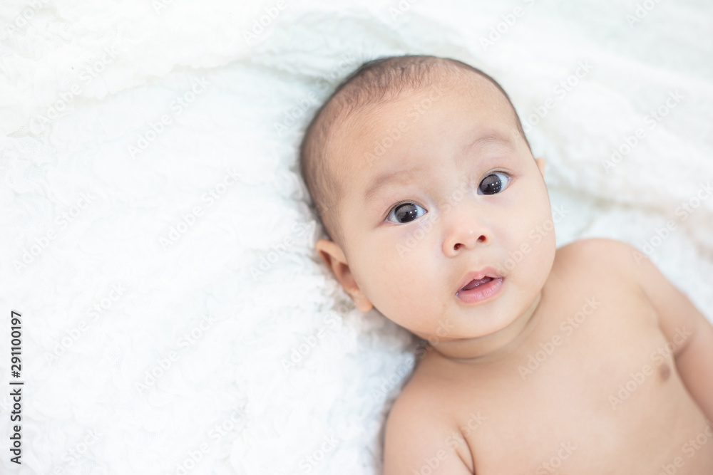 Cute little baby looking into the camera Cute little baby looking into the camera