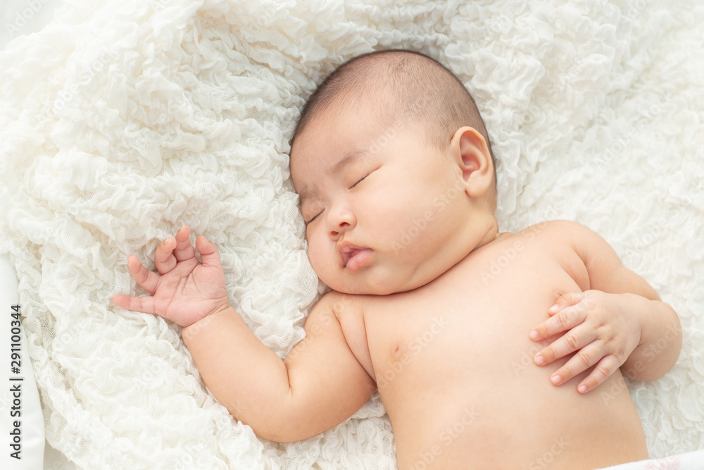 Baby lying on the bed Baby lying on the bed