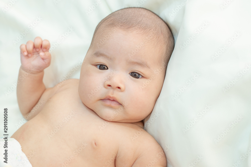 Cute little baby looking into the camera Cute little baby looking into the camera