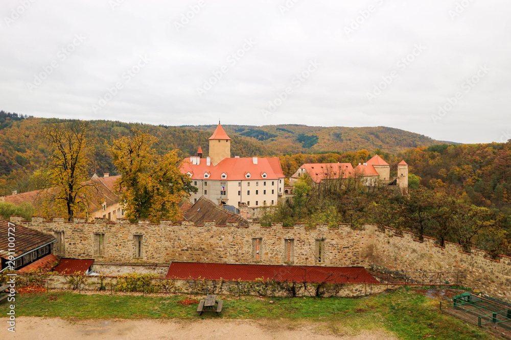View of the medieval Veveri castle in Czech republic surrounded by colorful autumn forest