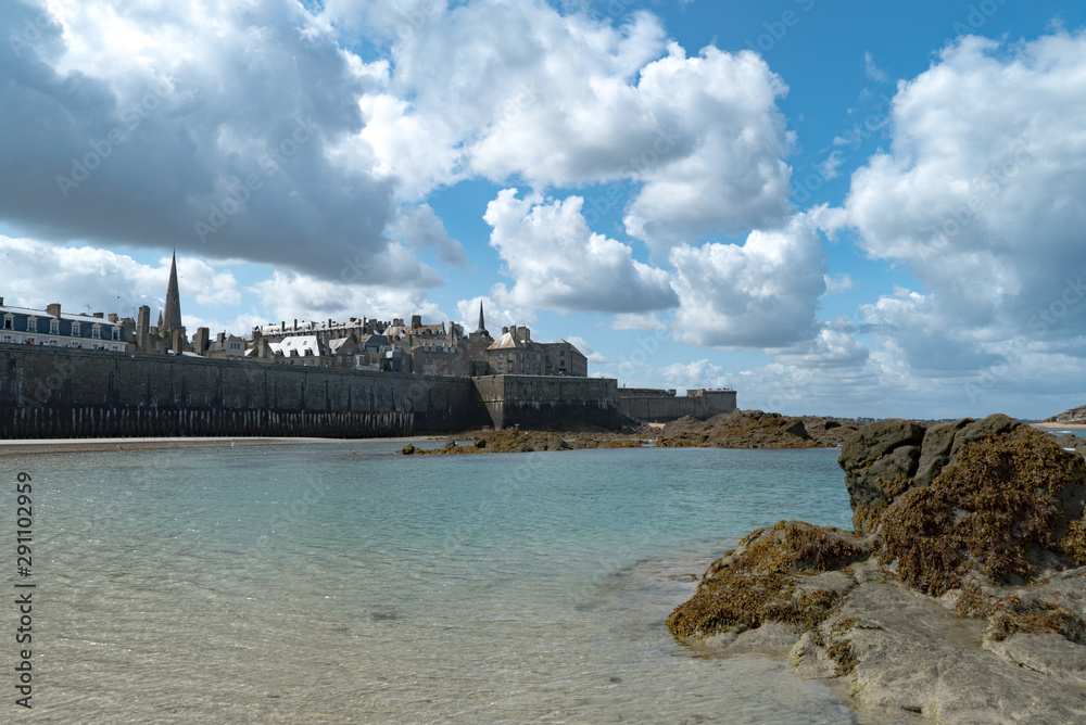 view of the historic old town of Saint-Malo with beach and coast at low tide