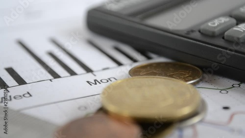 Calculator, graph and different falling coins