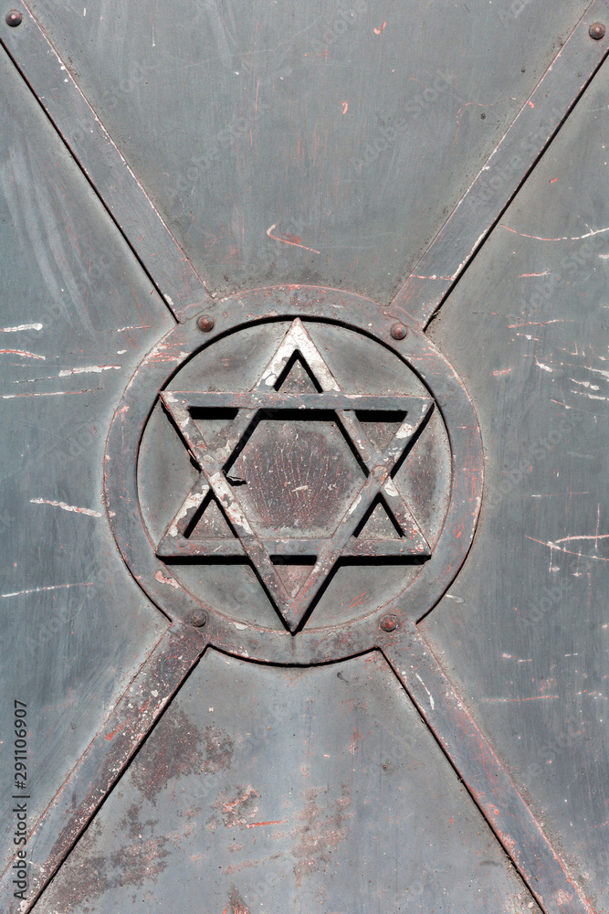 Jewish symbol, a metal Star of David on a steel gate, door detail