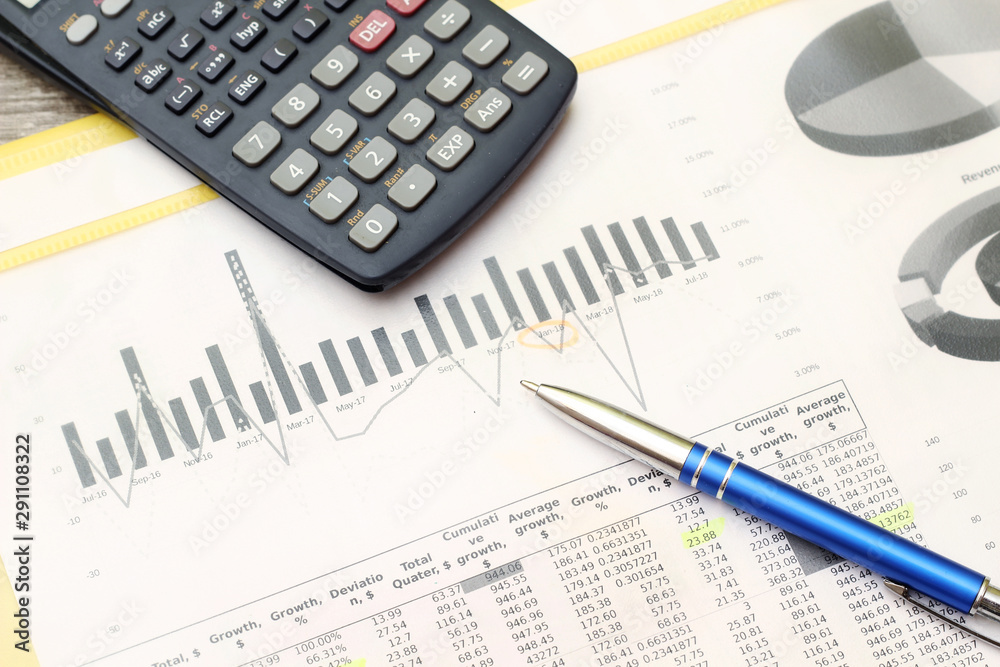Business concept with a report and a calculator Business concept with a report and a calculator