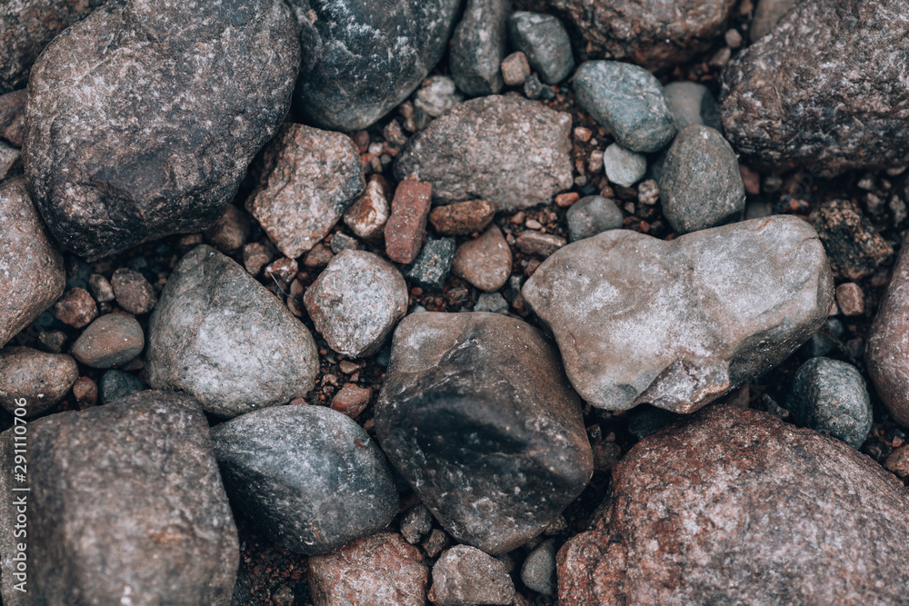 Stones. Photo background with stones. Stony ground view from above. Stones. Photo background with stones. Stony ground view from above.