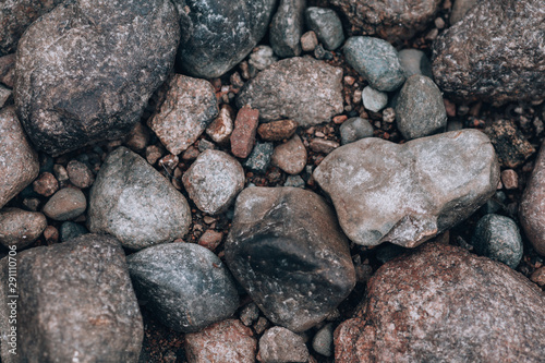 Stones. Photo background with stones. Stony ground view from above.
