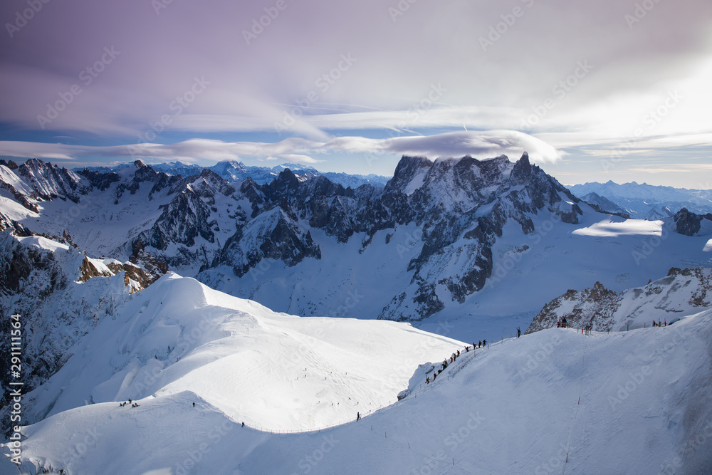 View from Aiguille du Midi, France. Skiers going down on Mer de Glace .