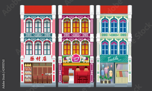 Colorful and historical colonial style three storey shophouse. Isolated. Caption: traditional herbal shop (left). 