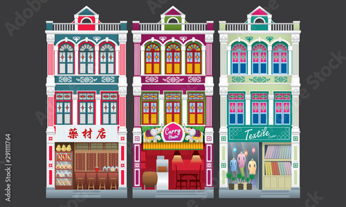Colorful and historical colonial style three storey shophouse. Isolated. Caption: traditional herbal shop (left).  photo