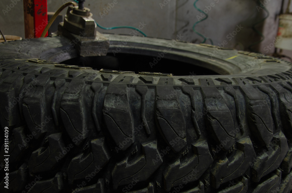 Fototapeta premium work of the master on tire fitting equipment