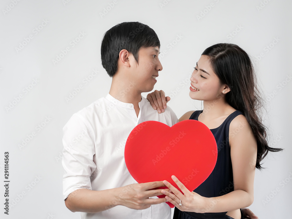 Happy couple in love holding red heart shape, valentine concept. Happy couple in love holding red heart shape, valentine concept.