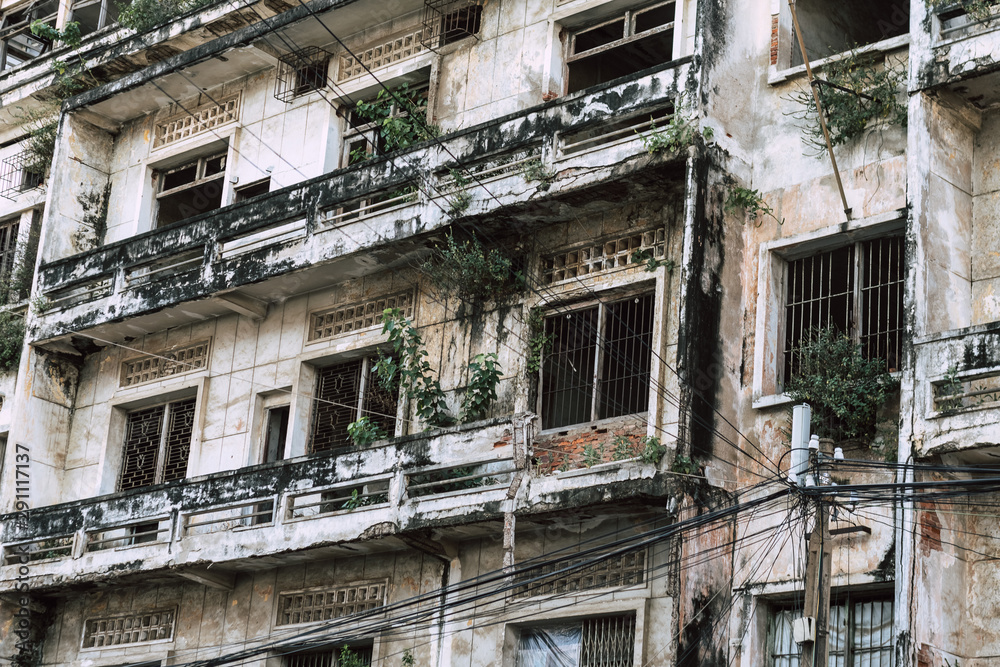 abandoned house with decadent facade with moss in Phnom Penh in cambodia abandoned house with decadent facade with moss in Phnom Penh in cambodia