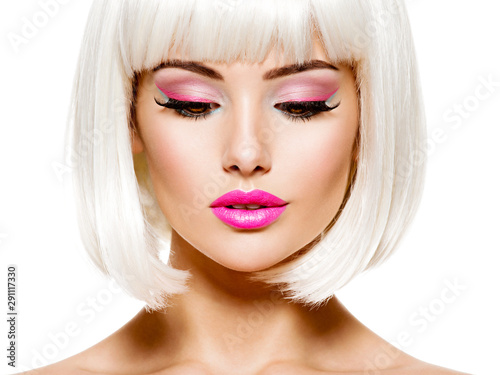 Face of a fashion model with bright pink make-up and bob hairstyle