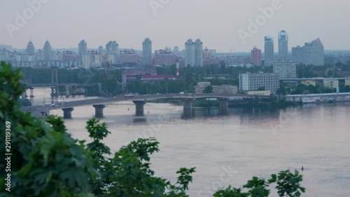 Panorama of the city of Kiev, Ukraine, evening after sunset. Dnipro River. Dnieper River, Obolonsky District. Havanskyi Bridge photo