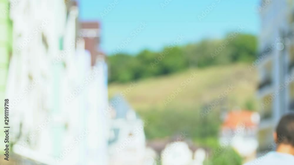 Teenage boy throwing flowers walking away, upset by bad date, girl did not come Teenage boy throwing flowers walking away, upset by bad date, girl did not come