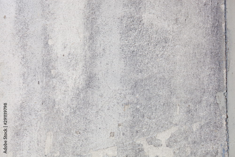 Texture of a concrete wall with cracks and scratches which can be used as a background Texture of a concrete wall with cracks and scratches which can be used as a background