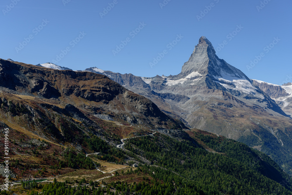 Amazing View of the mountain Matterhorn, Zermatt, Valais in the Swiss Alps, blue sky, no clouds in early autumn. Amazing View of the mountain Matterhorn, Zermatt, Valais in the Swiss Alps, blue sky, no clouds in early autumn.
