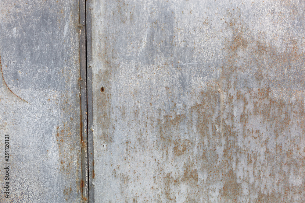 Metal texture with scratches and cracks which can be used as a background Metal texture with scratches and cracks which can be used as a background