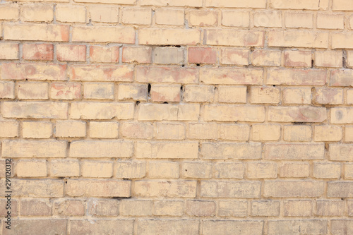 Texture, brick, wall, it can be used as a background . Brick texture with scratches and cracks