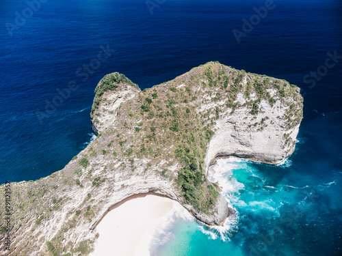 Panoramic view Kelingking Beach Manta Bay or Karang Dawa, on Nusa Penida Island, Bali Indonesia. Tropical beach with a turquoise ocean among the rocky cliffs Sunset on a tropical island Travel concept photo