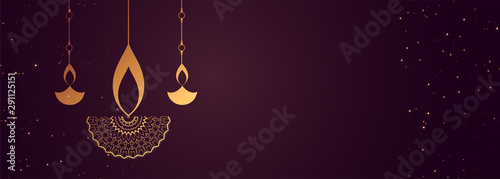 purple happy diwali banner with decorative diya design