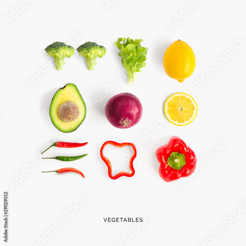 Creative layout made of avocado, red pepper, chili pepper, broccoli, lettuce, onion and lemon. Flat lay. Food concept.