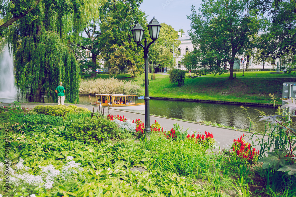 City Riga, Latvia republic. Riga Central Park with tourists and flowers, resting place..18 Aug. 2019