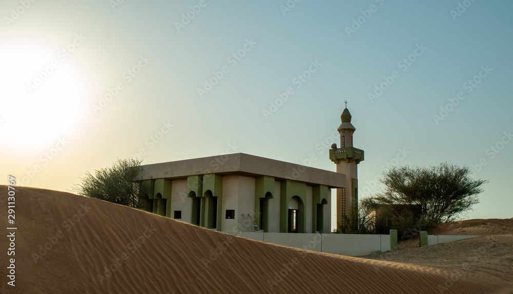 Mosque in the UAE desert. Gost town in UAE. Mosque in the middle of the sand dunes.