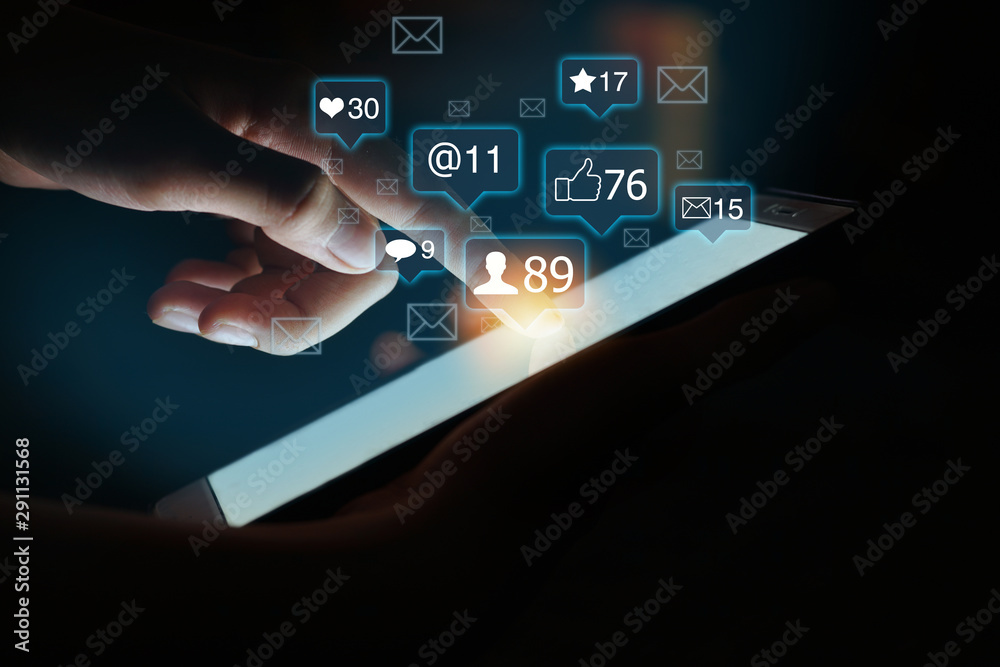 Fototapeta premium Finger on smart phone touch screen. Business, Social Media and Digital Marketing concept