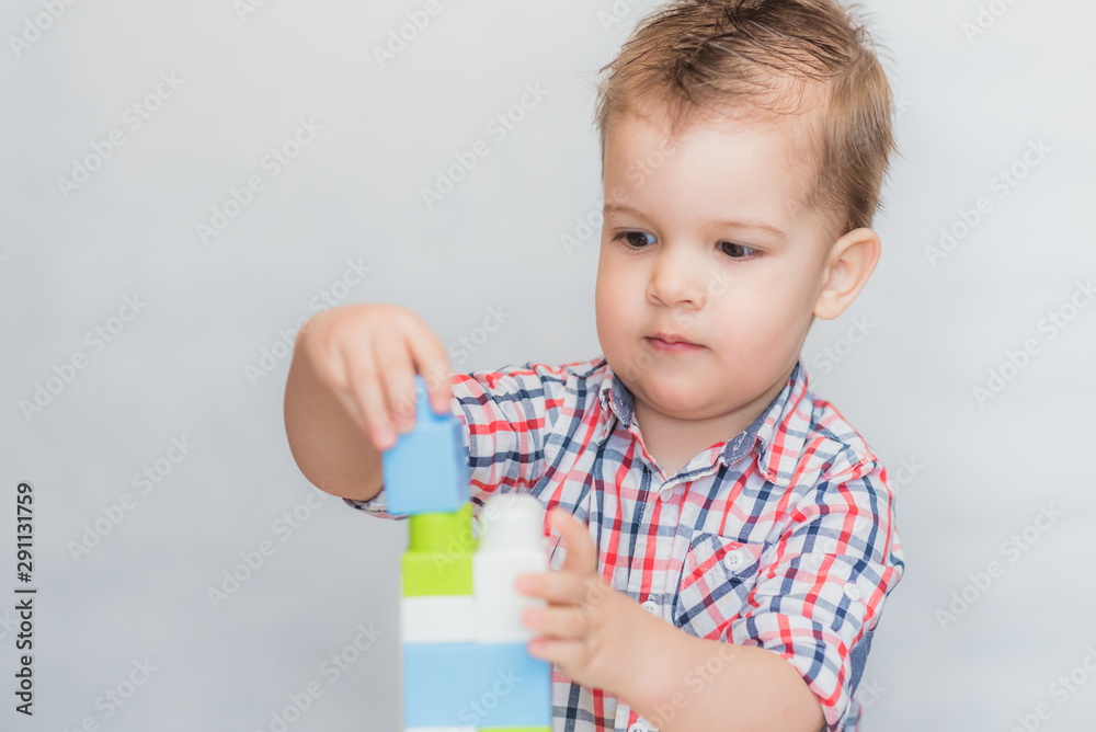 the baby is playing with the designer at home the baby is playing with the designer at home