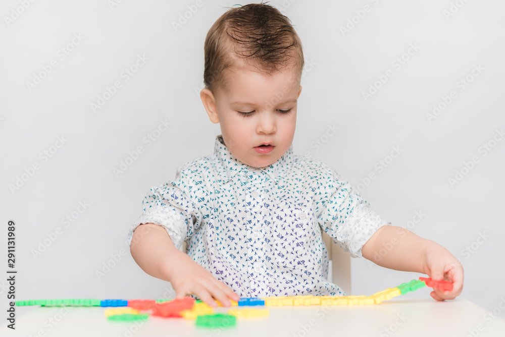 the baby is playing with the designer at home the baby is playing with the designer at home