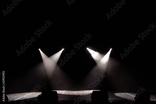 Canvas-taulu The light of searchlights in smoke on stage of the theatre.